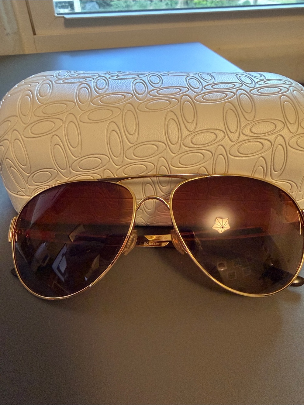 Oakley Gold Frame Aviator Sunglasses with Brown Lenses